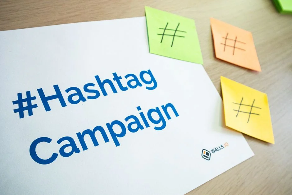 Close-up of a notebook page with Social Media Marketing handwritten on it.